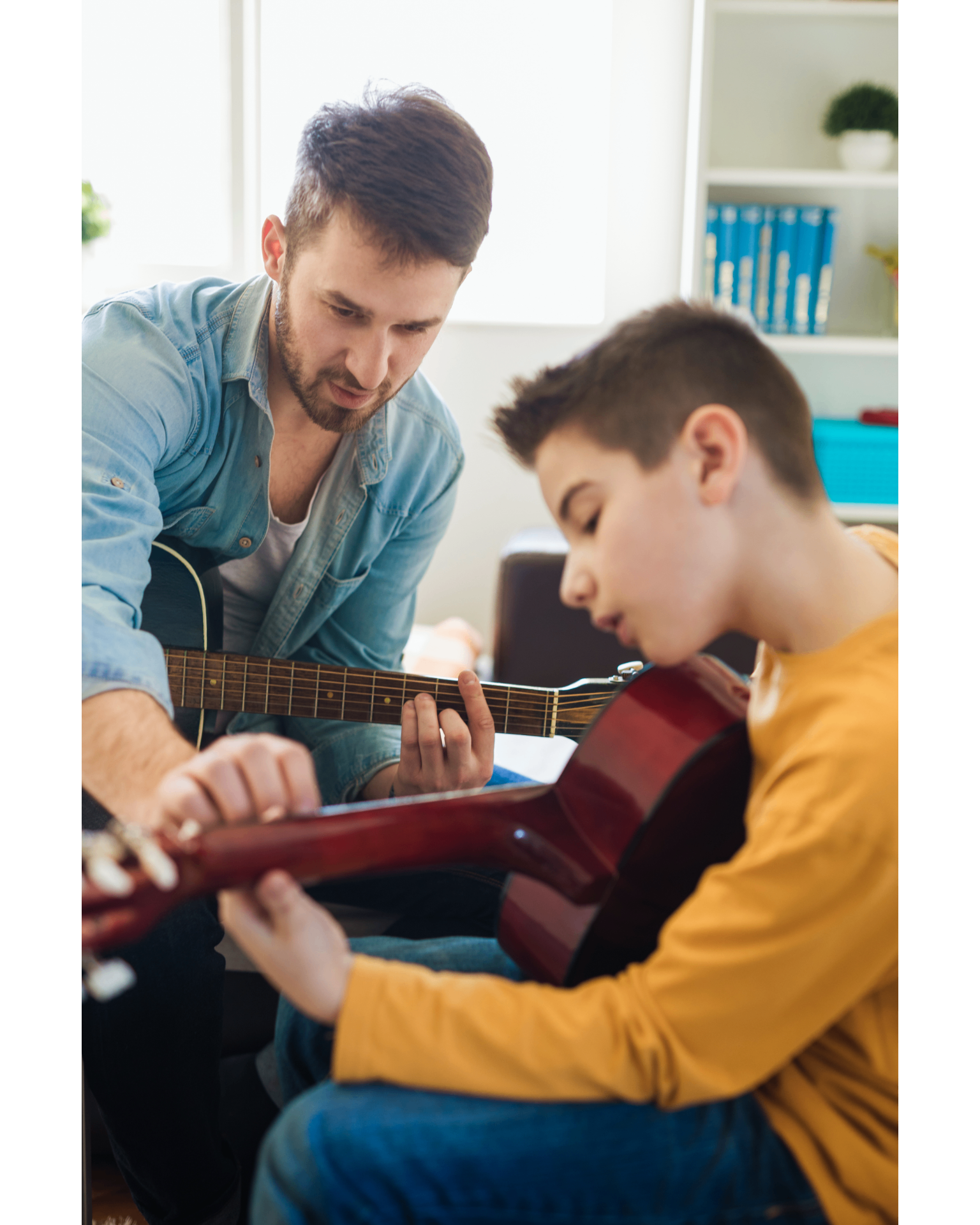 Guitar instructor teaching a young student in a bright studio